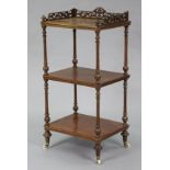 A Victorian oak three-tier whatnot, with pierced fret-work gallery, on turned supports with