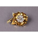 An 18ct yellow & white gold heraldic rose brooch with seven outer petals, the white five-petal