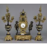 A 19th century style Continental clock garniture, the mantel clock having enamelled dial, the