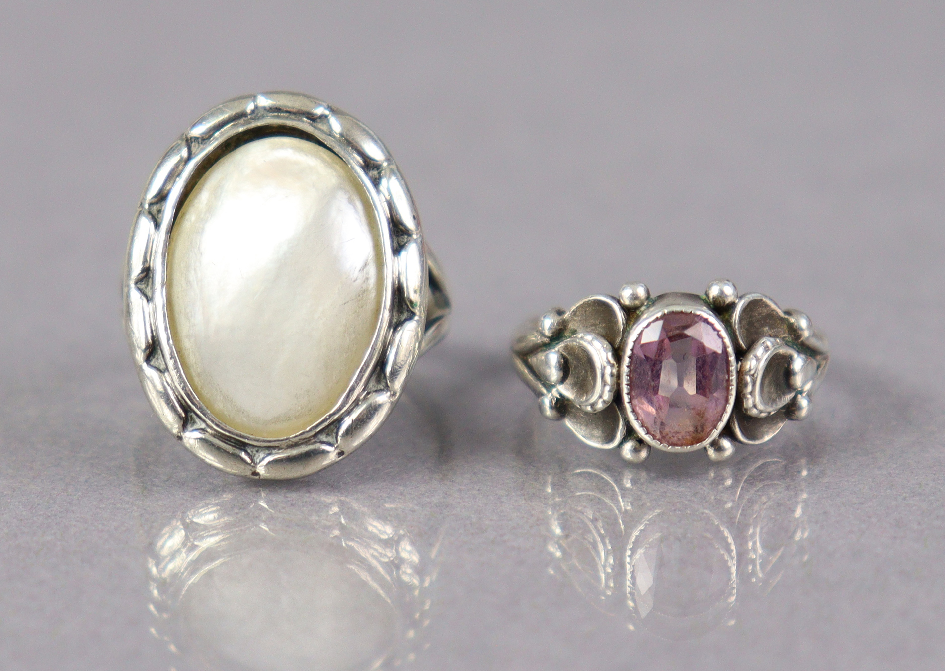 A Georg Jensen sterling ring set pink oval gemstone, size H (2.8g); & another Georg Jensen