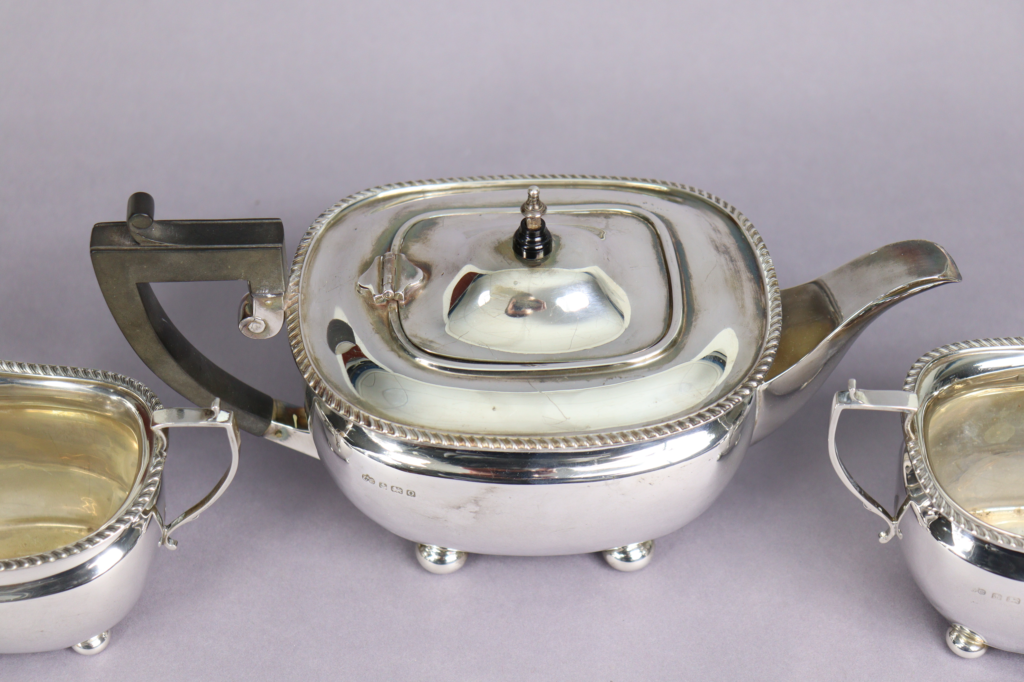 A George VI silver three-piece tea service in the regency style, of compressed oblong form with - Image 3 of 4