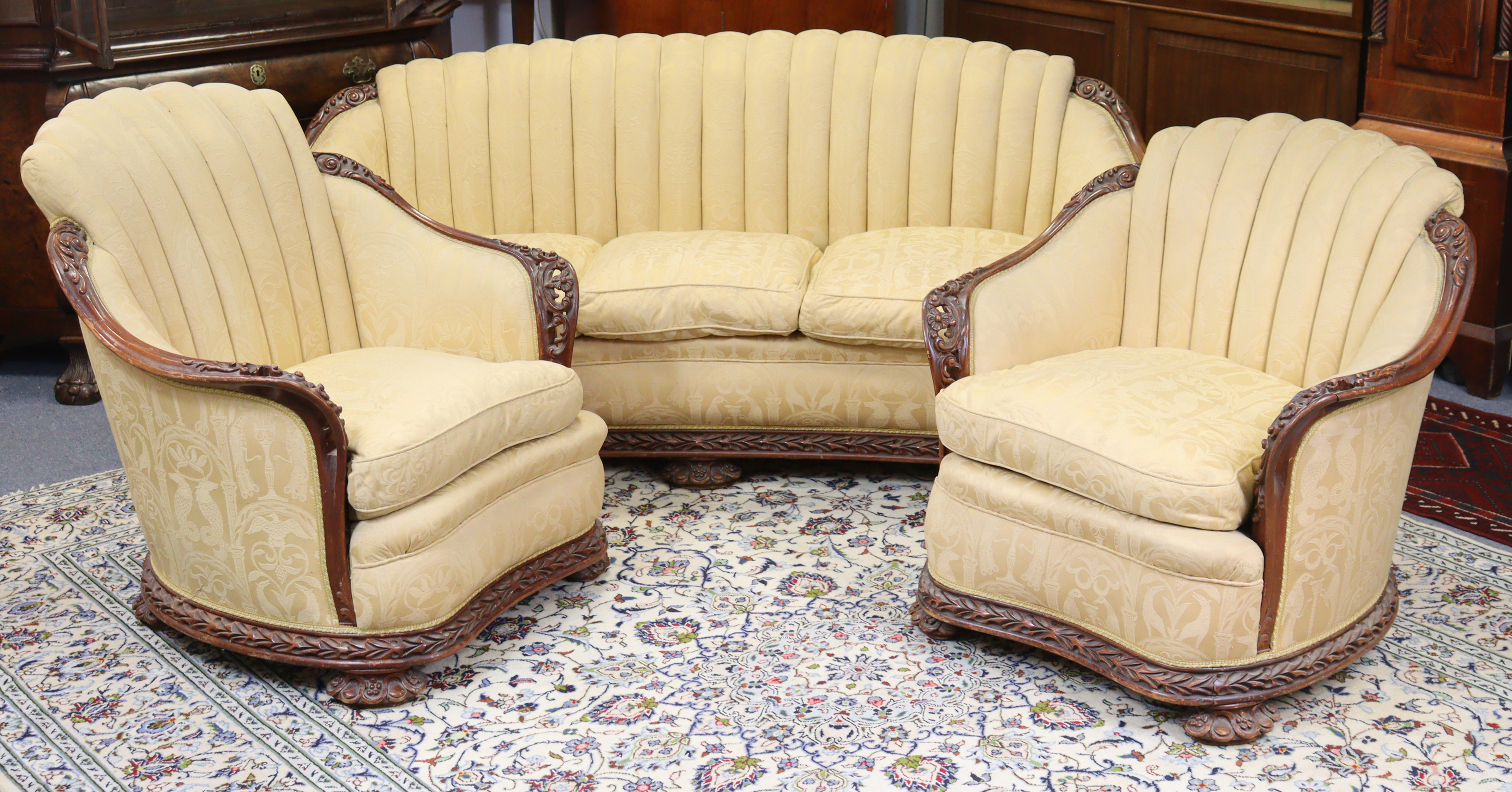 A Victorian mahogany frame three-piece suite, comprising a two-seater sofa and pair of armchairs, ea