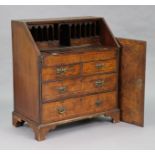 A Victorian burr-walnut bureau with well compartment to fitted interior enclosed by a sloping fall-