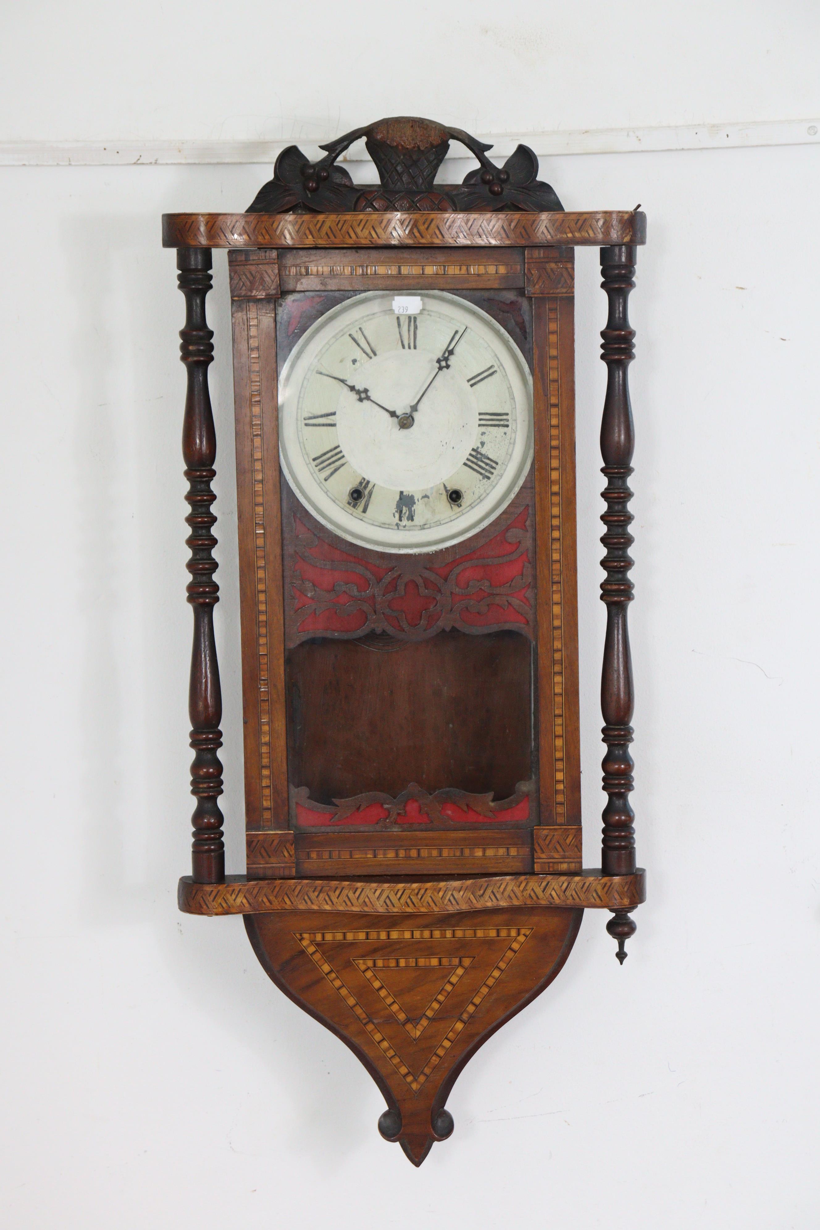 A 19th century wall clock in inlaid-walnut case, with painted dial & eight-day movement, 16” wide