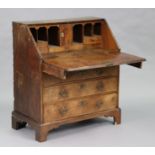 AN 18th century WALNUT & PINE BUREAU, with fitted interior enclosed by a sloping fall front, four