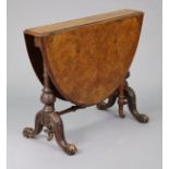 A Victorian burr-walnut Sutherland table with tapered edge to the oval drop-leaves, on carved &