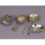 An Arts & Crafts planished silver caddy spoon with oval bowl & off-set pierced floral handle, Birmin