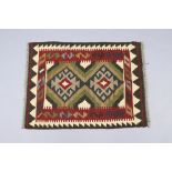 A Maimana kilim small rug of ochre ground with two lozenges & multicoloured geometric design within