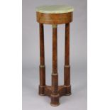 A 19th century flame mahogany-veneered gueridon with circular green marble top & plain frieze on