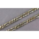 A 9ct gold chain necklace of flattened curb links with elongated links at intervals, 23½” long. (