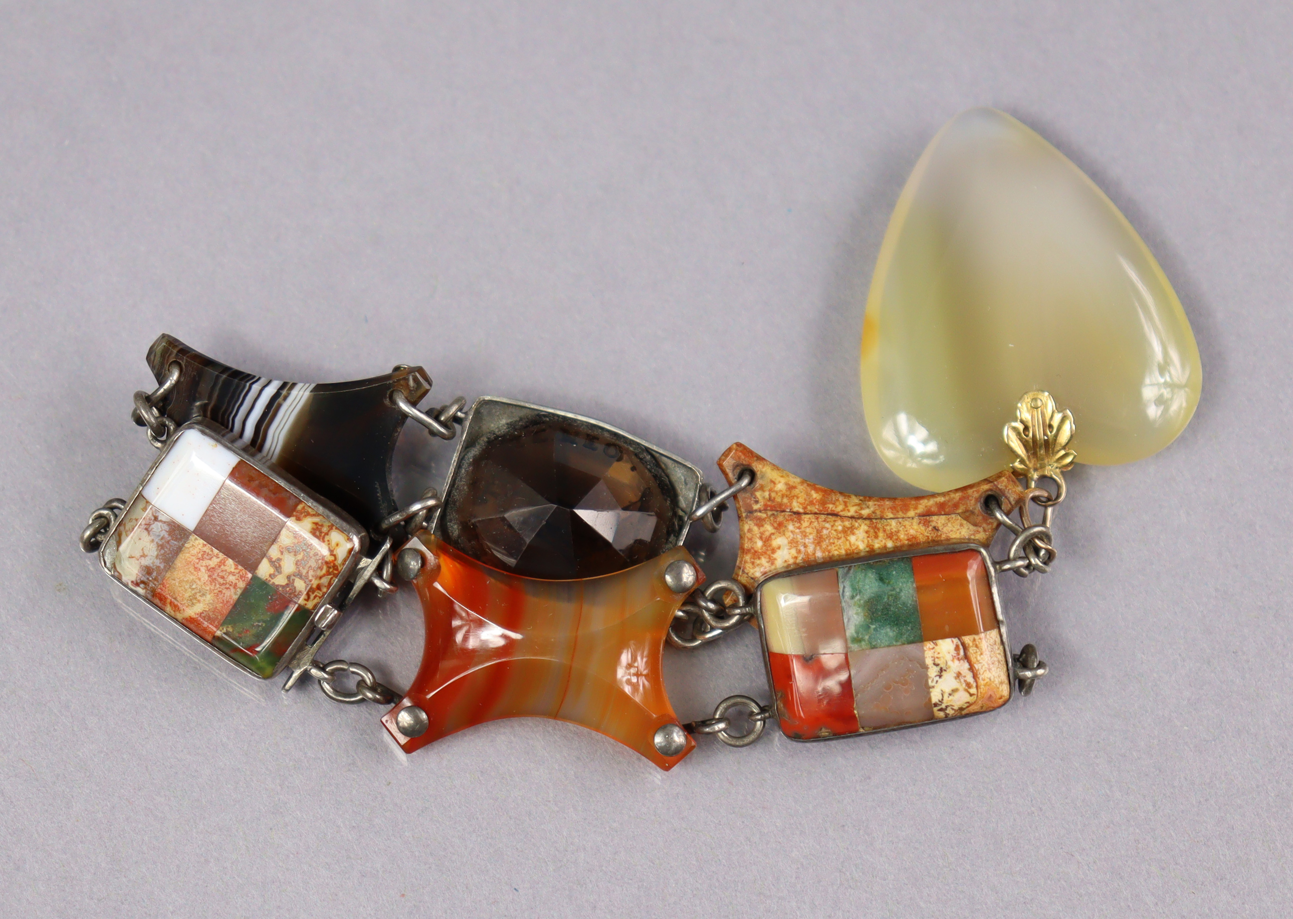 A Scottish flexible hardstone bracelet comprising various coloured stones, an intaglio seal, & with - Image 3 of 3