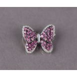 An 18ct white gold butterfly brooch, the wings set numerous small rubies within a border of small