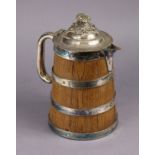 A Victorian coopered oak flagon with silver-plated banding, handle, & cover with engraved crest of