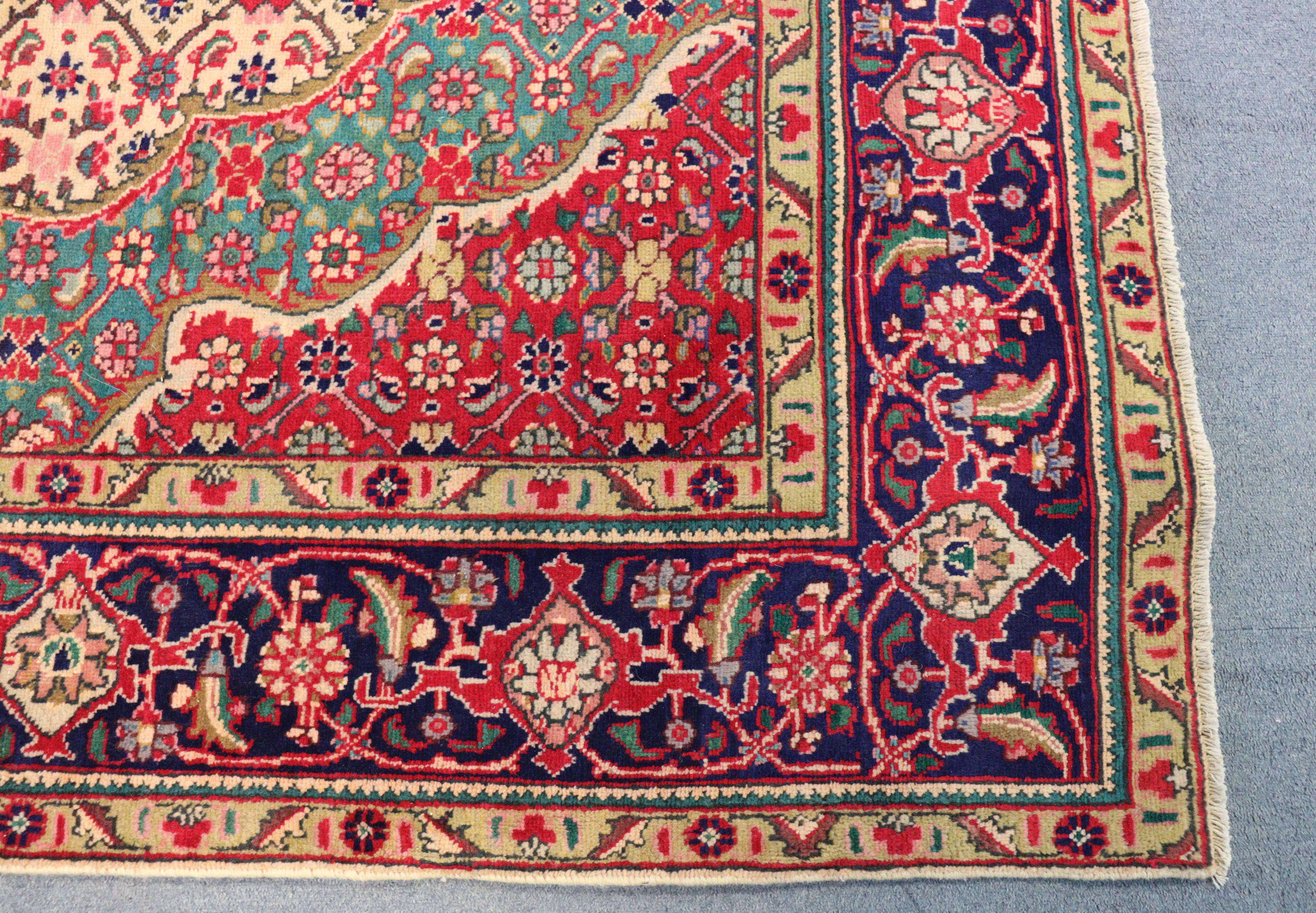 A NORTH WEST PERSIAN TABRIZ CARPET, with a central medallion surrounded by floral motifs, within wi - Image 3 of 4