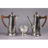 A pair of plated round tapered & planished café-au-lait jugs & sugar bowl; an engraved oval straight