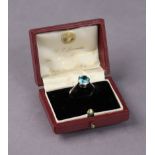 A white metal ring set round-cut blue gemstone, size L. (2.8g)