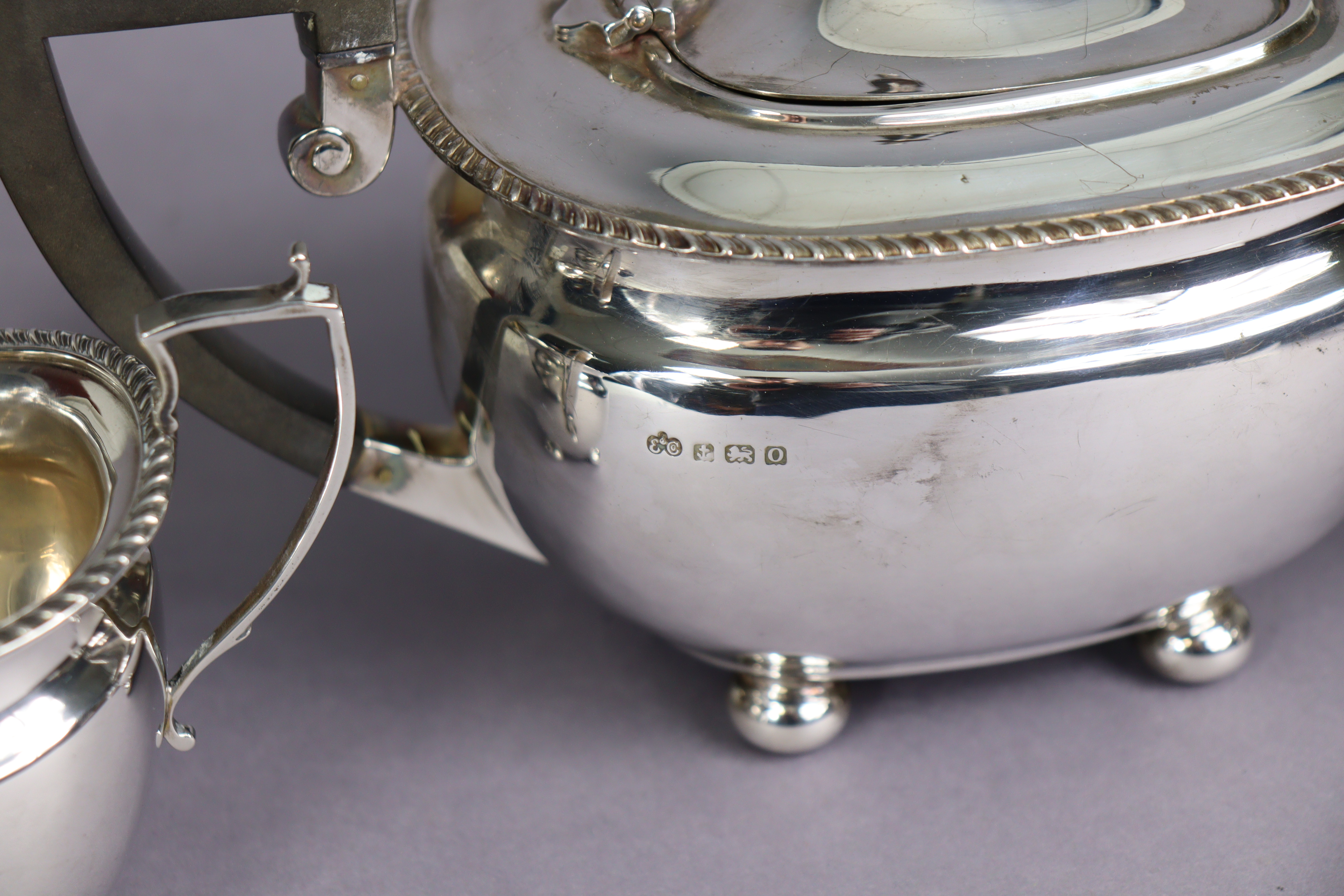 A George VI silver three-piece tea service in the regency style, of compressed oblong form with - Image 2 of 4