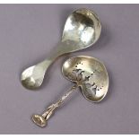 A contemporary Scottish caddy spoon with planished surface, curved handle, & oval bowl, 3⅞” long,