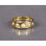 A Victorian 18ct gold ring set row of five graduated split pearls, Birmingham hallmarks for 1875;