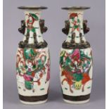 A pair of early 20th century Chinese crackleware baluster vases with famille rose decoration of