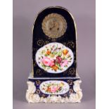 A mid-19th century French porcelain mantel clock with 4½” dia. gilt-metal & silvered dial, silk