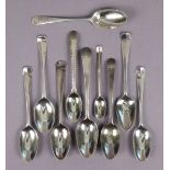 A group of nine 18th century silver teaspoons including a picture-back spoon, six shell-back spoons;