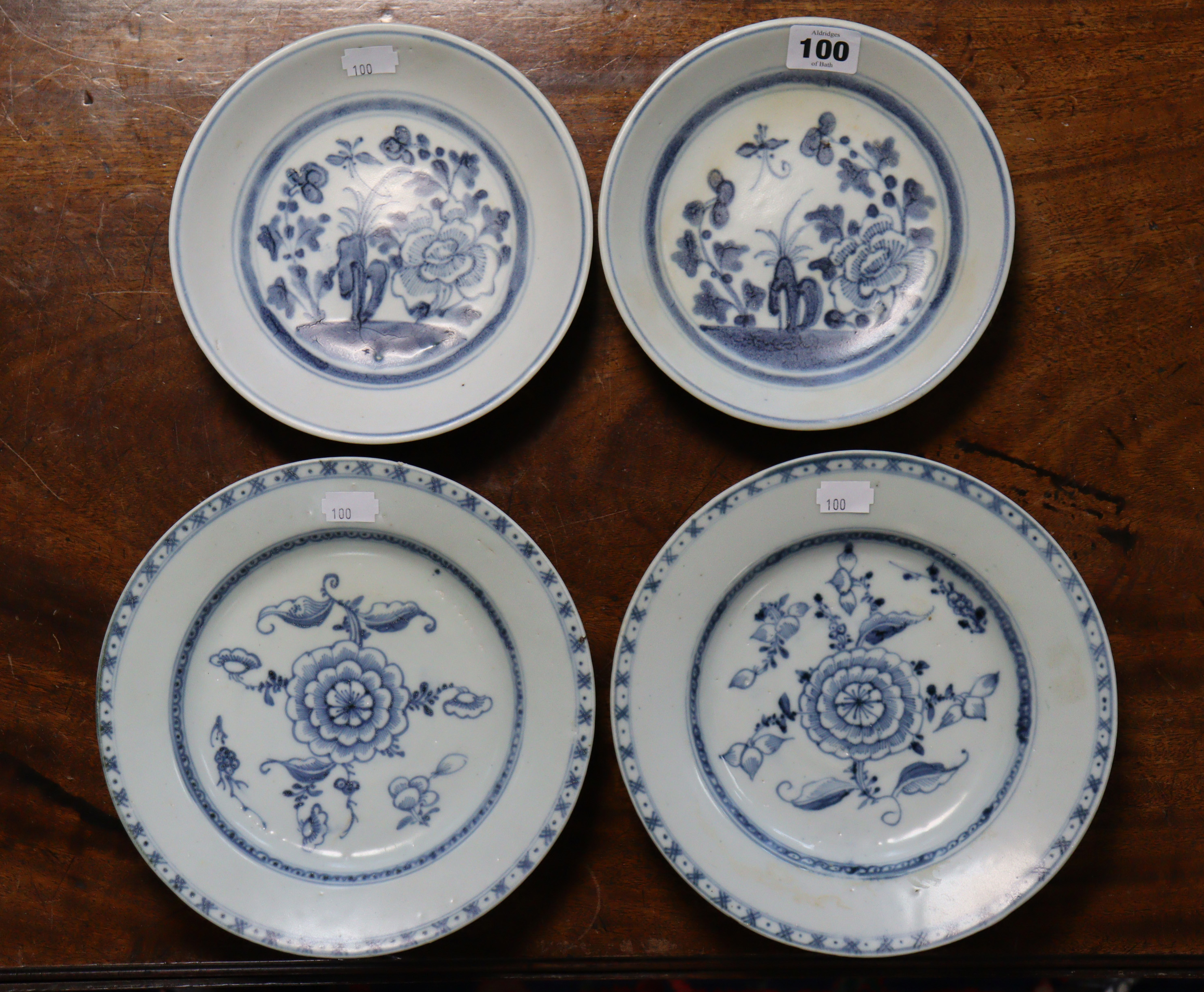 Tek Sing shipwreck cargo: a group of four provincial Chinese porcelain plates, with peony, butterfly