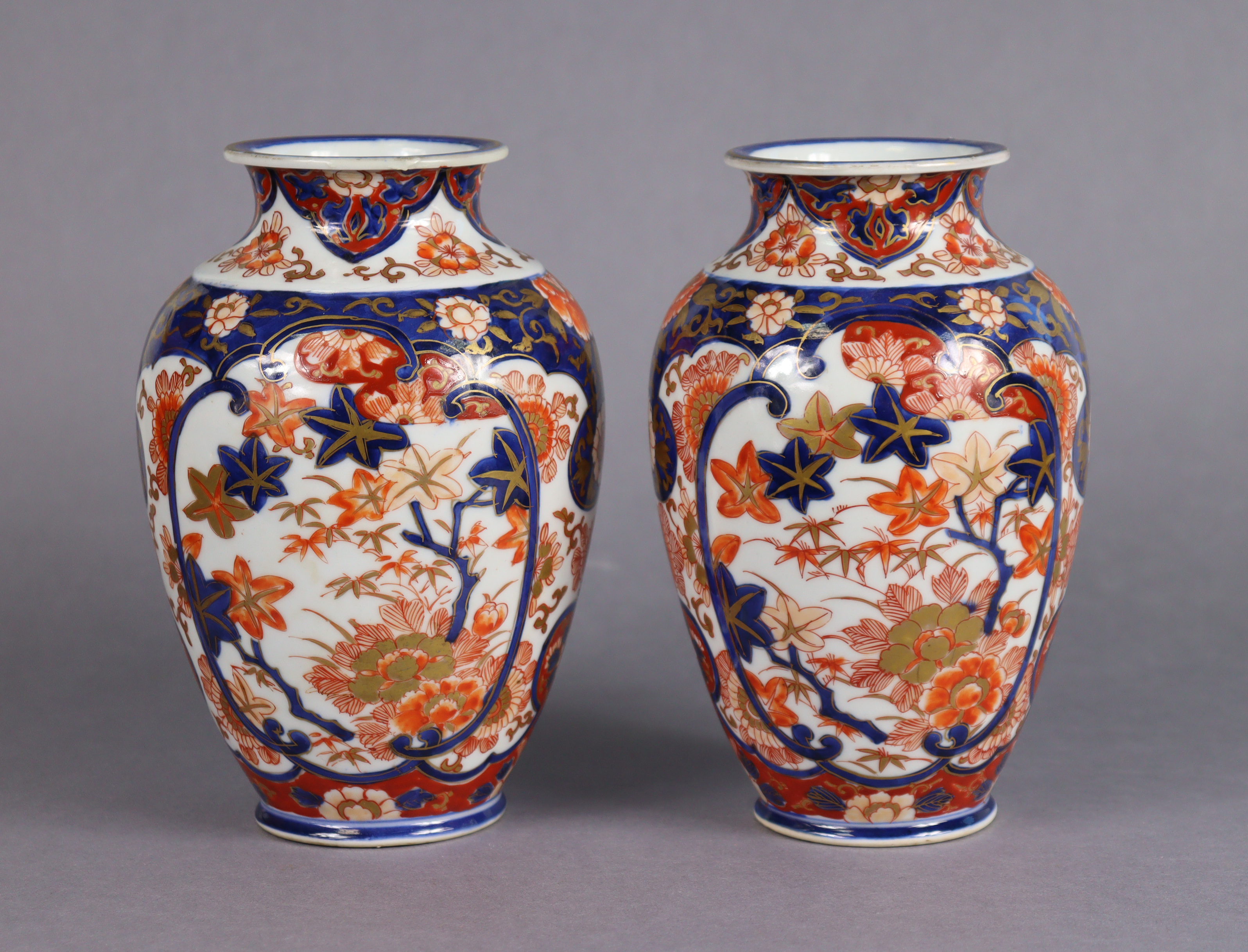 A pair of Japanese Fukugawa/Koransha Imari ovoid vases with all-over floral decoration in deep blue,