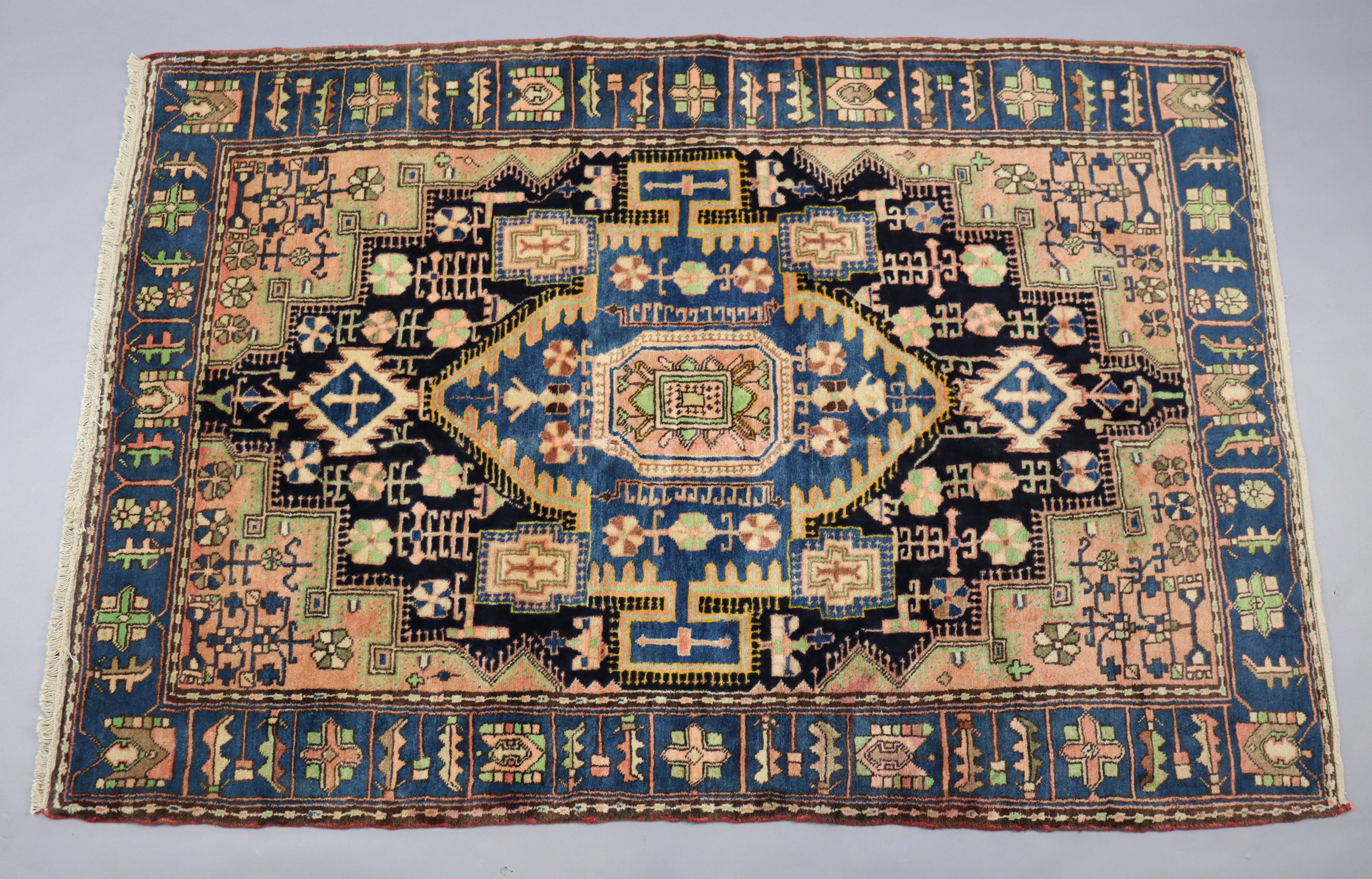 A north west Persian Nahawand rug of madder ground, the central medallion surrounded by floral