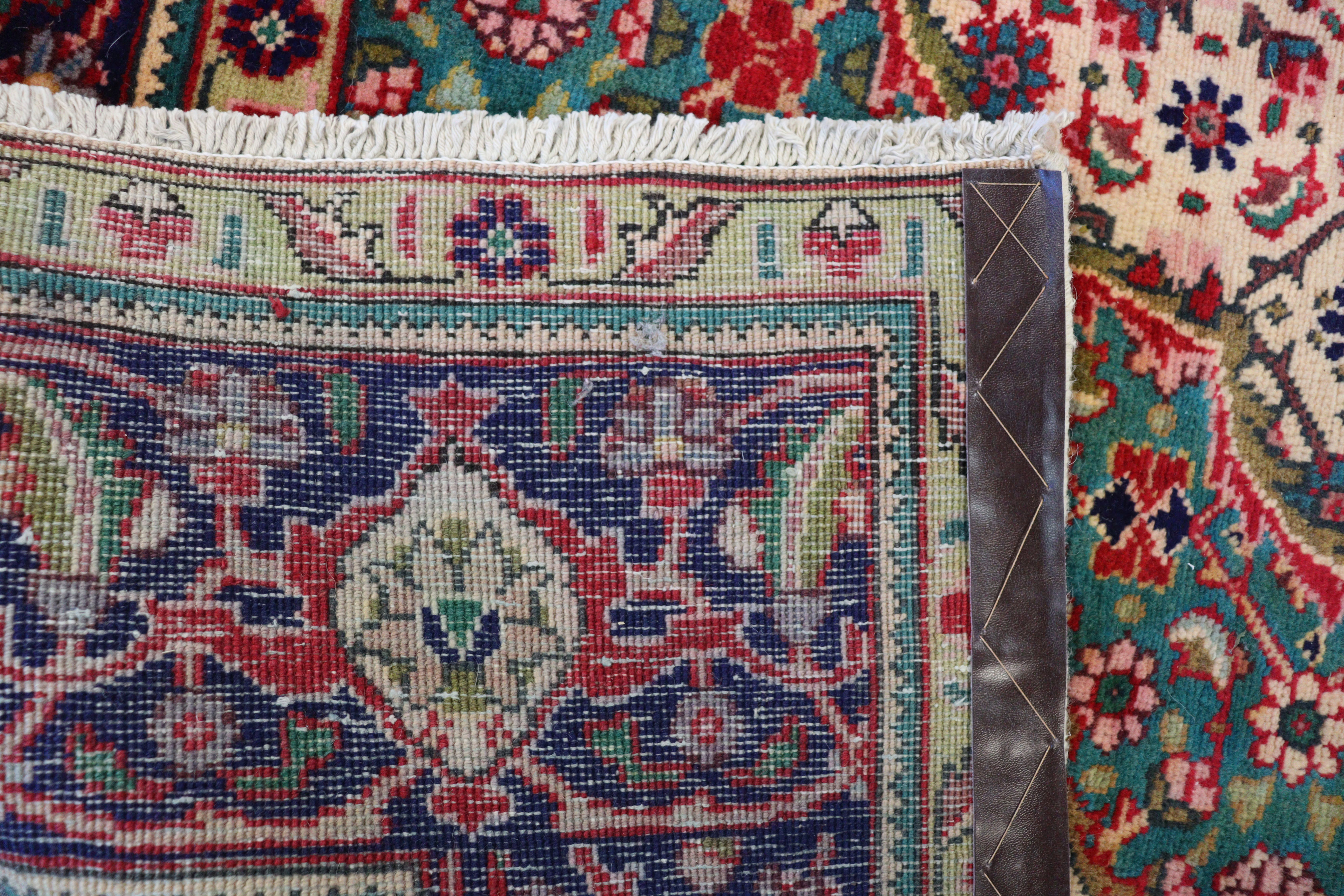 A NORTH WEST PERSIAN TABRIZ CARPET, with a central medallion surrounded by floral motifs, within wi - Image 4 of 4