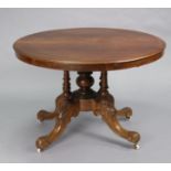 A Victorian pedestal table with moulded edge to the plain circular top, on turned centre column &