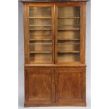 AN EARLY VICTORIAN MAHOGANY BOOKCASE, fitted eight adjustable shelves below the moulded cornice,