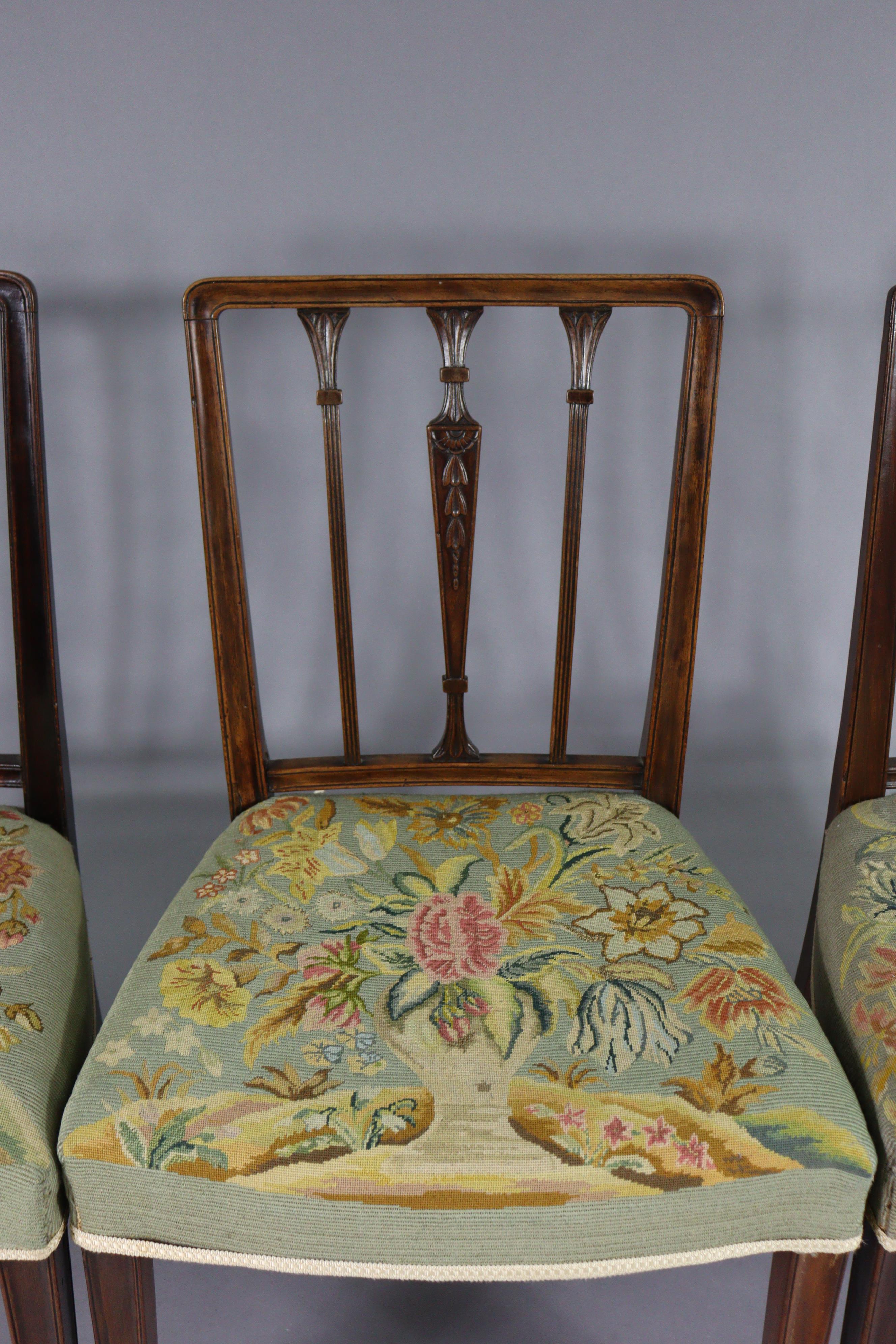 A set of four 19th century dining chairs with carved foliate decoration to the rail-backs, padded - Image 2 of 6