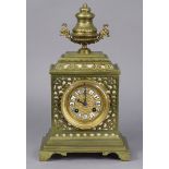 A late 19th/early 20th century continental mantel clock in pierced brass architectural case, the