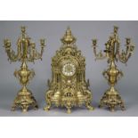 A 19th century style Continental clock garniture, the large mantel clock in pierced brass case