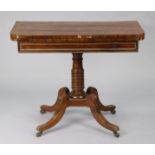 A Regency brass-inlaid rosewood card table with rounded corners to the rectangular fold-over top,