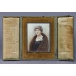 An early 20th century portrait miniature of a lady wearing fur stole, 4¾” x 3¾”, in brass frame &