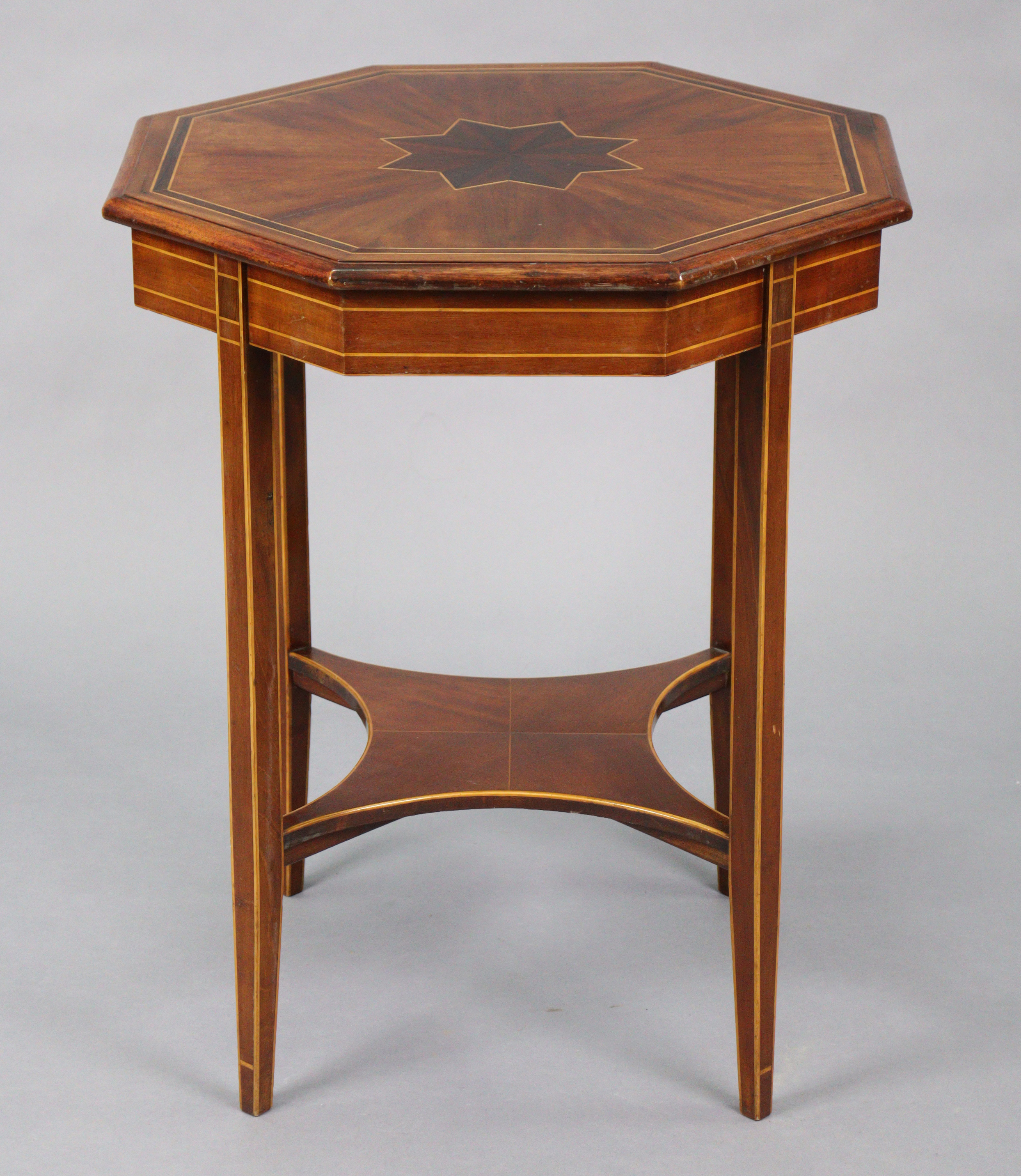 A late 19th/early 20th century inlaid mahogany occasional table with moulded edge to the octagonal