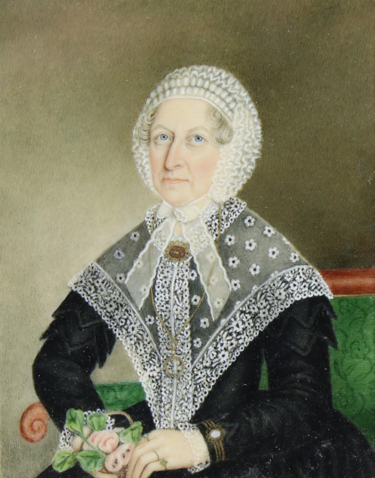 ENGLISH SCHOOL, 19th century. A portrait miniature of an elderly lady wearing lace bonnet (