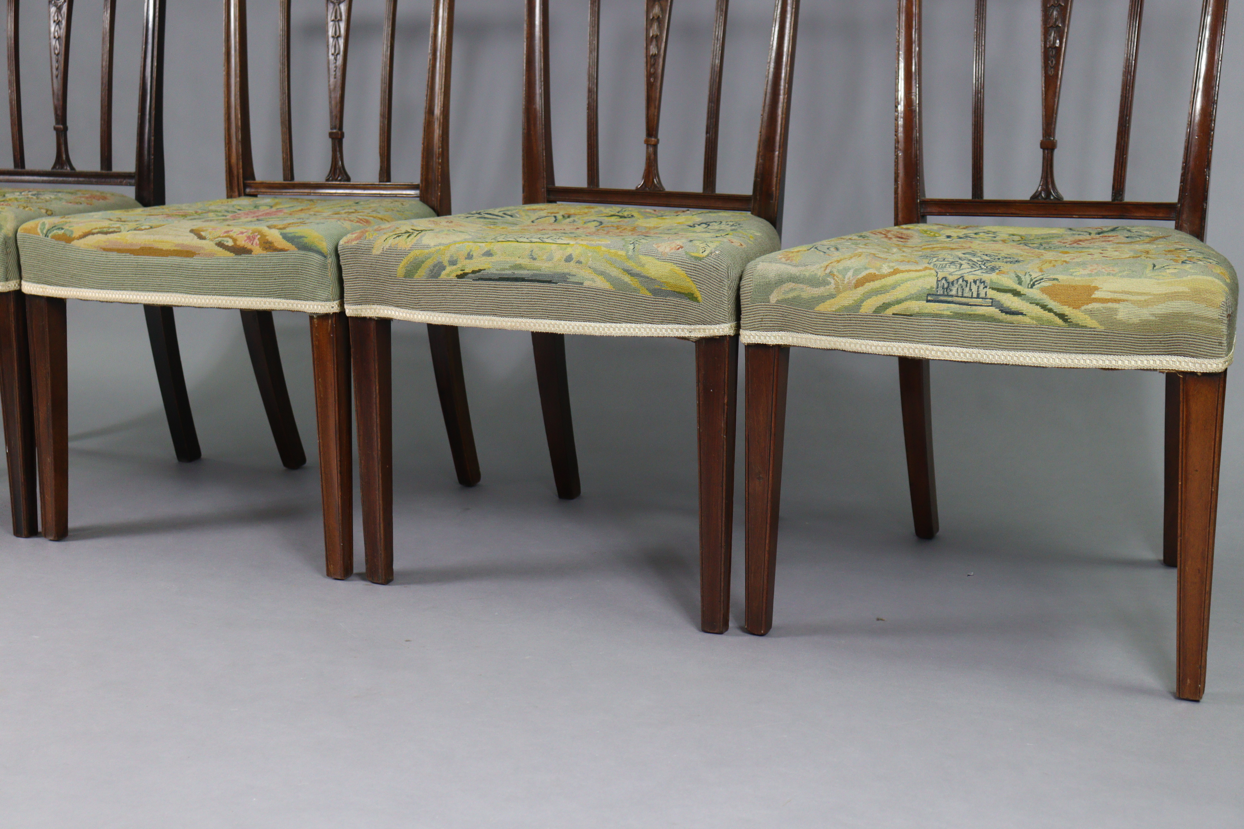 A set of four 19th century dining chairs with carved foliate decoration to the rail-backs, padded - Image 4 of 6