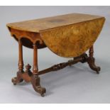 A Victorian burr elm veneered oval drop-leaf table on turned walnut legs with shaped grained end