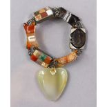 A Scottish flexible hardstone bracelet comprising various coloured stones, an intaglio seal, & with