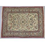 A PERSIAN SILK SMALL RUG, of cream ground with multi-coloured foliate decoration, the central