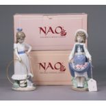 Two Lladro Nao figure ornaments “My Dog Does Tricks” (No 00379), and “Girl With Flowers In Skirt” (