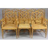 A set of twelve faux bamboo dining chairs (including a pair of carvers), each with a woven cane