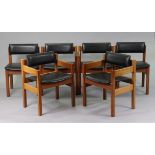 A set of six teak dining chairs (including four carvers) each with a padded seat & back, & on square