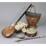 A 19th century copper engraved warming pan with a turned wooden handle; a copper coal bucket;