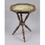 A Beech gypsy table inset embroidered floral panel to the octagonal top, & on three turned supports,