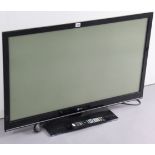 An LG 42” television with a remote control.