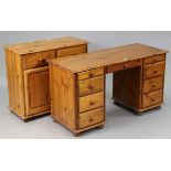 A pine knee-hole dressing table fitted with an arrangement of nine drawers, & on bun feet, 52”